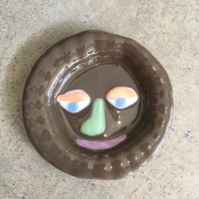Brown Pot Plant Face by Lawn Bowls